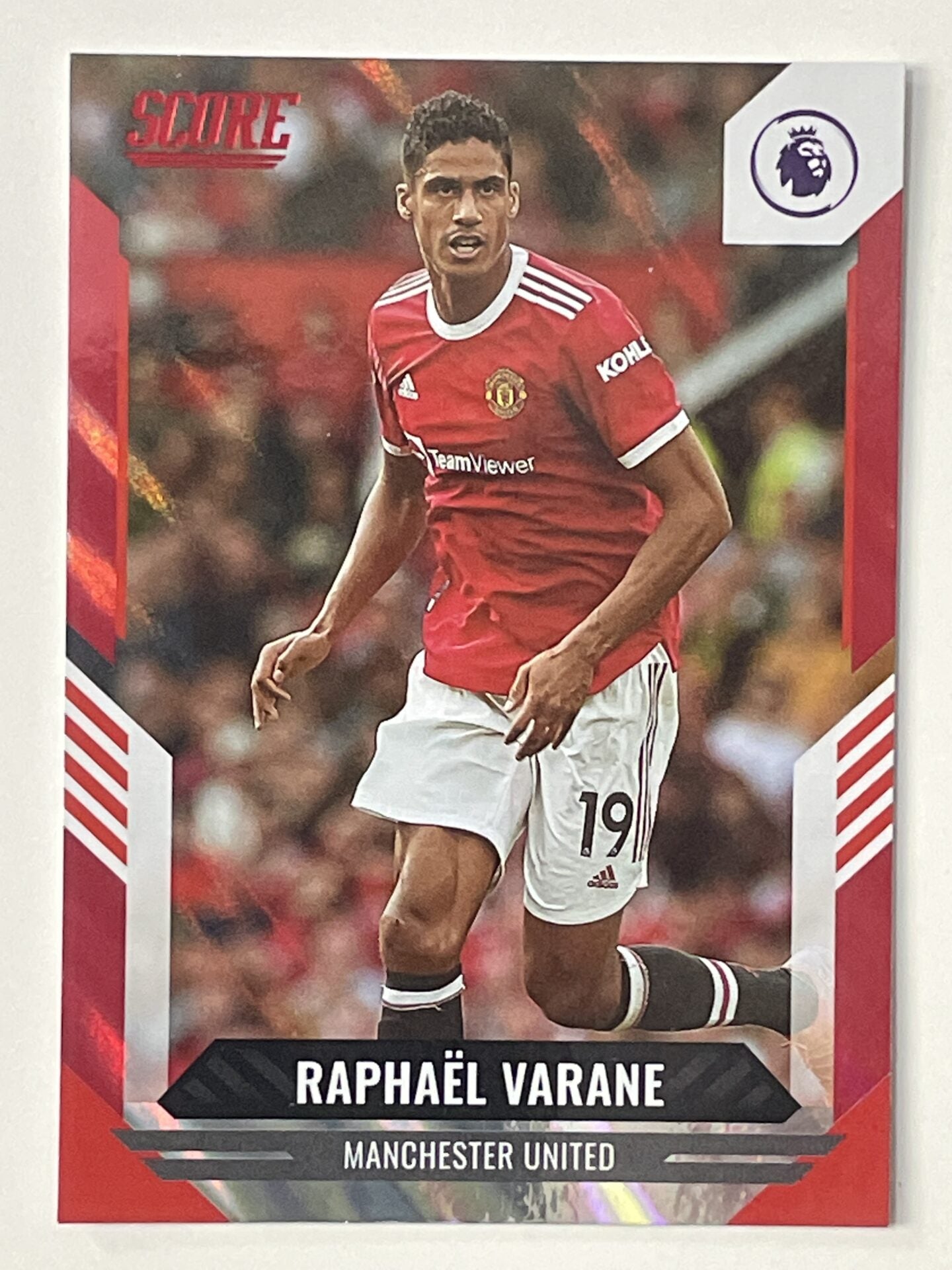 Raphael Varane Manchester United Base Red Lava Parallel Panini Premier League Score 2021 2022